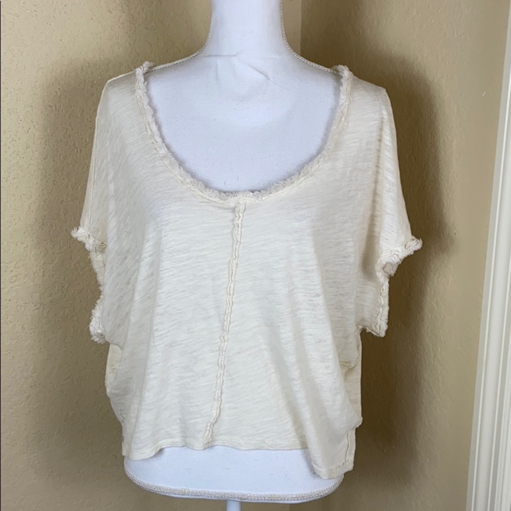 Like new Free People fray hem cream top M
